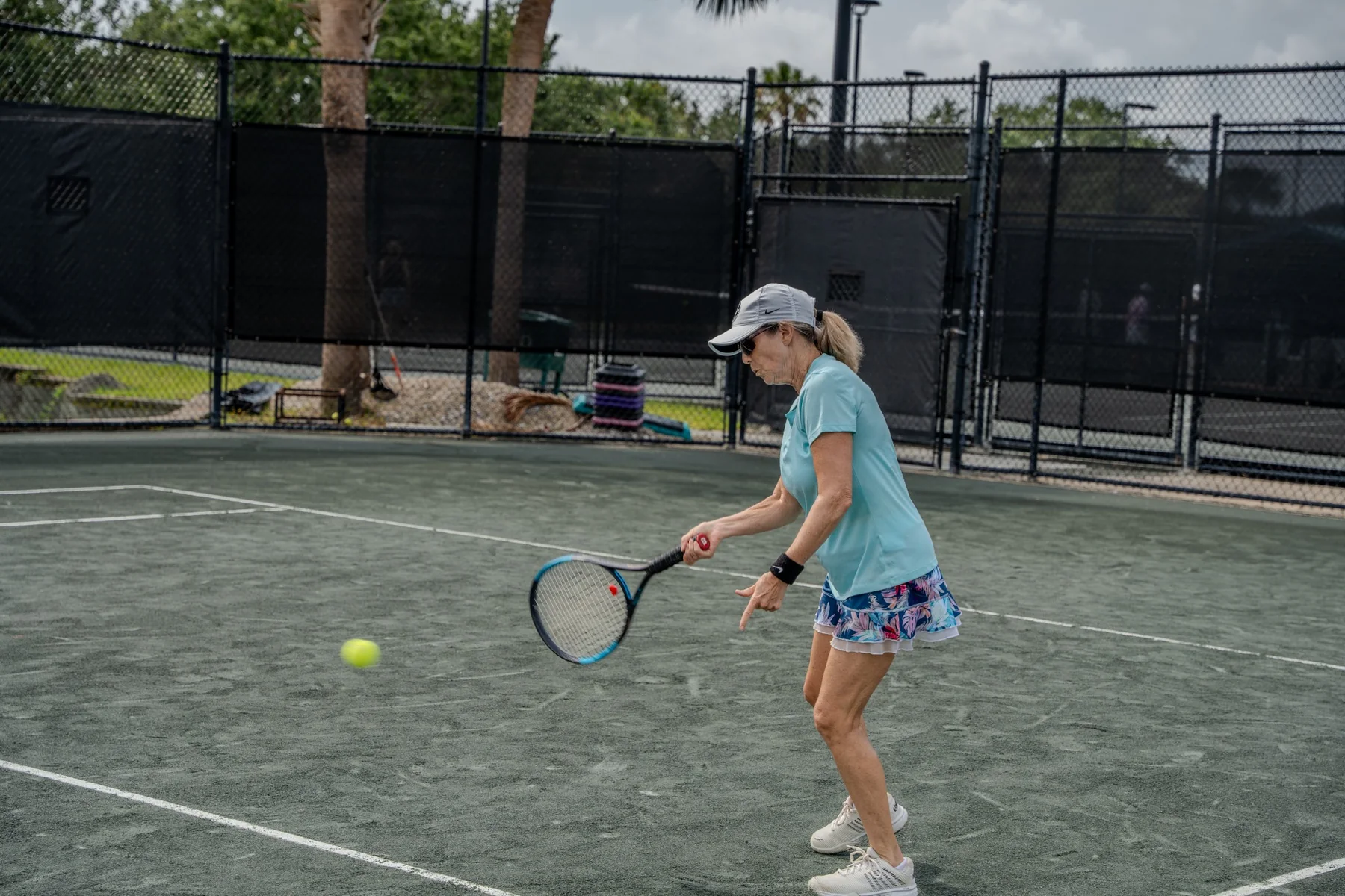 Tennis players participating in BLVD club play